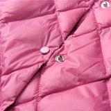 A pink women's lightweight quilted jacket featuring a diamond pattern, displayed against a neutral background. The jacket emphasizes comfort with its soft fabric and vibrant pink hue.