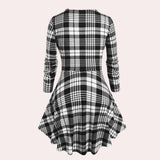 Black and white checkered plaid dress with long sleeves and knee-length design, featuring a classic collar.