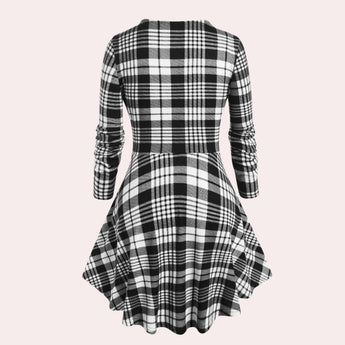 Black and white checkered plaid dress with long sleeves and knee-length design, featuring a classic collar.
