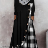 Plaid long-sleeve midi dress featuring a cowl neck and contrast hem, with a focus on the shoulder and waist detailing.