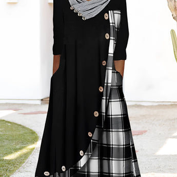 Plaid long-sleeve midi dress featuring a cowl neck and contrast hem, showcasing a blend of black and white patterns with a defined waist.
