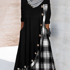 Plaid long-sleeve midi dress featuring a cowl neck, contrast hem, and checkered pattern in black and white.