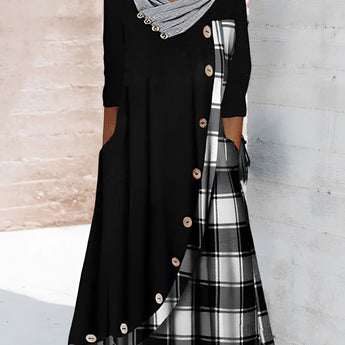 Plaid long-sleeve midi dress featuring a cowl neck, contrast hem, and checkered pattern in black and white.