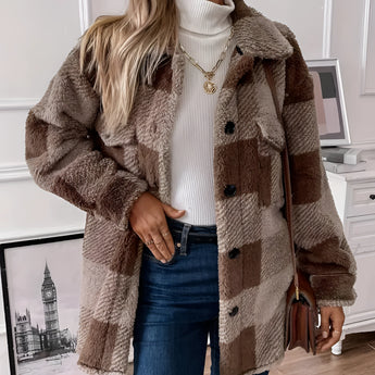 Oversized brown teddy coat for women featuring a plaid pattern, shown in size 2XL. The coat has a soft, warm texture with a beige and grey tartan design, long sleeves, and a comfortable fit.