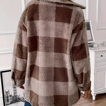 Plaid oversized brown teddy coat for women, featuring a winter outerwear design with a tartan pattern, shown worn by a woman.