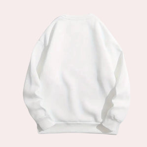 Plain white unisex crewneck sweatshirt displayed flat, highlighting its minimalist design and casual style.