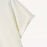 Plain white unisex t-shirt on a hanger against a plain background.