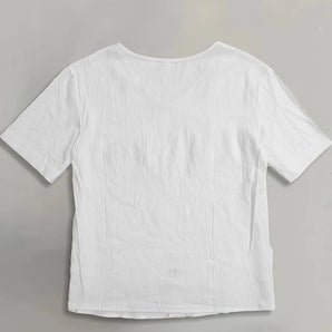 Plain white women's short sleeve t-shirt made of lightweight, breathable cotton, displayed on a flat surface.