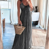 Pleated beige shimmer maxi dress with flowing skirt, suitable for an evening beach wedding. The dress features delicate pleats, sleeveless design, and is shown in XL size.