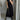 Pleated maxi dress in taupe with cap sleeves, designed for summer wear. The dress features a flowing, one-piece silhouette and a defined waist, suitable for a formal or casual setting. The image shows the dress with a Nero color and in 3XL size, highlighting the elegant fashion style.