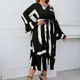 Plus Size Abstract Print Midi Dress with Long Sleeves and Tie Waist, suitable for party attire, featuring a knee-length design.