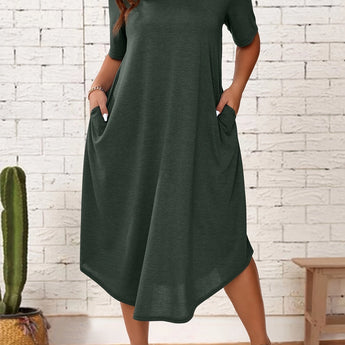 Dark green plus size loose fit midi dress featuring a casual and oversized design, highlighting the one-piece garment with short sleeves and a comfortable waistline, suitable for summer wear, displayed on a standing figure.