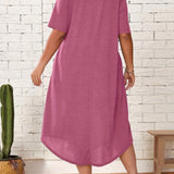 Plus size green loose fit midi dress featuring a casual oversized design with short sleeves and a round neckline, ideal for summer wear.