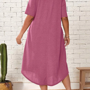 Plus size green loose fit midi dress featuring a casual oversized design with short sleeves and a round neckline, ideal for summer wear.