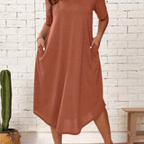 
A plus size orange-red loose fit midi dress featuring short sleeves, a round neckline, and a relaxed silhouette suitable for casual summer wear. The dress includes a waistline detail and is shown on a standing model.