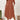 
A plus size orange-red loose fit midi dress featuring short sleeves, a round neckline, and a relaxed silhouette suitable for casual summer wear. The dress includes a waistline detail and is shown on a standing model.
