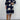 Plus size marine blue v-neck boho summer dress featuring floral embroidery, shown on a model. The dress is a one-piece garment with short sleeves.