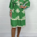 Plus size green V-neck boho summer dress with floral embroidery, featuring short sleeves and a flowing silhouette, designed for a comfortable and stylish fit in 3XL size.