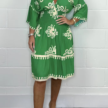 Plus size green V-neck boho summer dress with floral embroidery, featuring short sleeves and a flowing silhouette, designed for a comfortable and stylish fit in 3XL size.