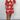 Plus size red V-neck boho summer dress with floral embroidery, featuring short sleeves and a fitted waistline, styled with white footwear.