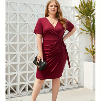 Plus size olive green knee-length bodycon dress with stylish design elements, featuring fitted sleeves and a flattering silhouette ideal for casual wear.
