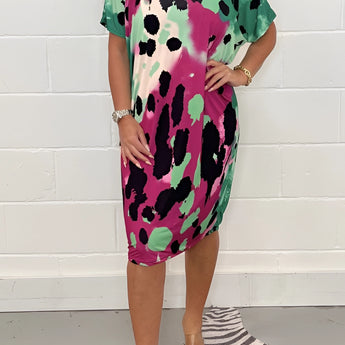 Plus size olive green leopard satin dress with short sleeves, ideal for a summer party. The dress is showcased on a model wearing size 3XL, highlighting the dress's elegant drape and chic design.