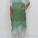 Plus size green and mint tie-dye maxi kaftan beach cover-up with batwing sleeves displayed on a model, highlighting the loose fit, flowing design, and vibrant colors against a plain background.
