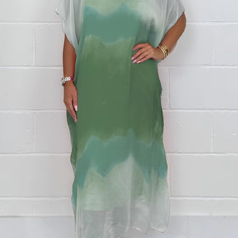 Plus size green and mint tie-dye maxi kaftan beach cover-up with batwing sleeves displayed on a model, highlighting the loose fit, flowing design, and vibrant colors against a plain background.