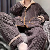 
A women's winter coat made from warm sherpa fleece, featuring a plush teddy bear texture. The grey jacket includes a wrap-style design with long sleeves and a wide collar, offering both style and comfort.