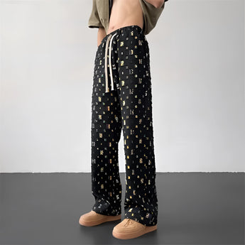 Retro photo print streetwear trousers featuring a vibrant Polaroid pattern, shown on a standing model. The pants highlight details such as the waist, thigh, and knee areas, capturing a unique and eye-catching style.