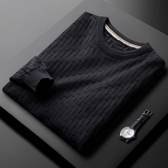 Premium men's blue sweater featuring a braided texture, ribbed cuffs, and cozy knit material, displayed on a wooden table.