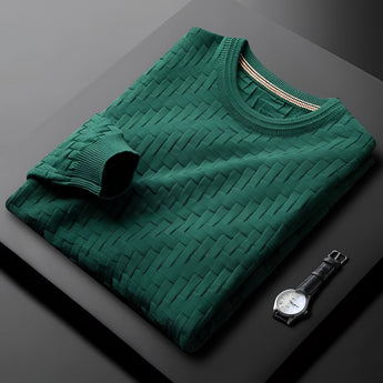 Premium men's blue sweater with braided texture and ribbed cuffs displayed on a wooden surface.