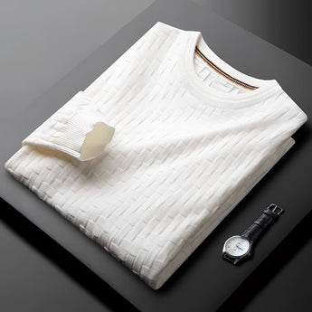 Premium men's blue sweater with braided texture and ribbed cuffs displayed on a wooden table.