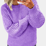 Purple chunky cable knit sweater for women in lavender color, 3XL size, featuring long sleeves and a cozy collar, showcased with the sweater worn by an individual displaying a gesture.