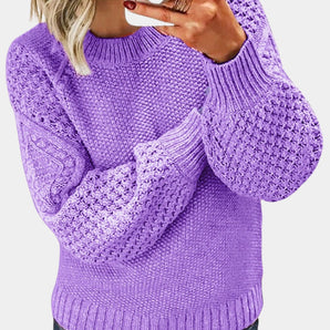 Purple chunky cable knit sweater for women in lavender color, 3XL size, featuring long sleeves and a cozy collar, showcased with the sweater worn by an individual displaying a gesture.