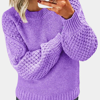 Purple chunky cable knit sweater for women in lavender color, 3XL size, featuring long sleeves and a cozy collar, showcased with the sweater worn by an individual displaying a gesture.