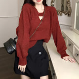 Purple V-neck mohair sweater for women displayed on a mannequin, featuring a cozy knit texture with long sleeves.