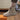 Quilted waterproof winter boots for women in khaki, size 42, featuring a cushioned sole. The boots are displayed on a wooden floor near a flowerpot.