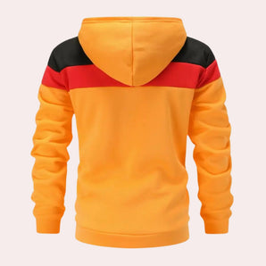 Men's color block streetwear hoodie in red, black, and yellow with long sleeves, featuring a casual and modern design.