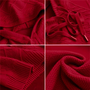 A red cable knit sweater with a luxurious textured design, showcasing intricate patterns and knitting style.
