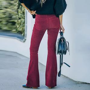 Red corduroy women's high-waist flared bell bottom pants with a vintage design.