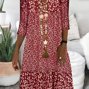 Red Floral Bohemian V-Neck Mini Dress with Tassels - Summer Casual Wear in 5XL displayed on a hanger, featuring a vibrant red color with floral patterns and decorative tassels.
