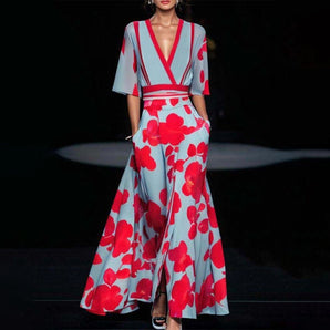 Red floral kimono maxi dress with deep V-neck, featuring long sleeves and a fitted waist, designed for evening wear occasions.