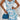 Blue sleeveless designer cocktail dress with floral patterns and ruffled details, displayed in a one-piece garment style.