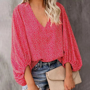 Red floral V-neck long sleeve women's casual blouse in bohemian style, featuring a vibrant red pattern with floral motifs, designed as a loose-fitting top suitable for casual wear. The blouse has a V-neckline and long sleeves, perfect for adding a touch of elegance and comfort to any outfit.