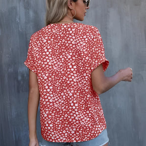 Red Floral Women's V-Neck Summer Blouse, Lightweight, Short Sleeve, modeled on a woman with visible arms, neck, and white background.