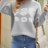 Black pullover sweater featuring a bold red lip print design, styled with long sleeves and a round neckline, displayed on a mannequin or model wearing sunglasses, highlighting the chic and modern fashion statement ideal for casual outings.