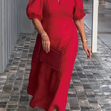 
A red maxi dress with puff sleeves and a square neck, featuring studded pockets. The dress is showcased in a 5XL size.