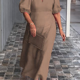 Red maxi dress with puff sleeves and a square neck, featuring studded pockets. The dress is in a Cachi color and is size 5XL.