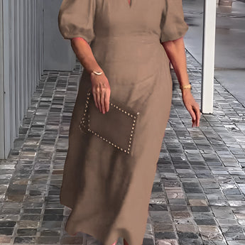 Red maxi dress with puff sleeves and a square neck, featuring studded pockets. The dress is in a Cachi color and is size 5XL.
